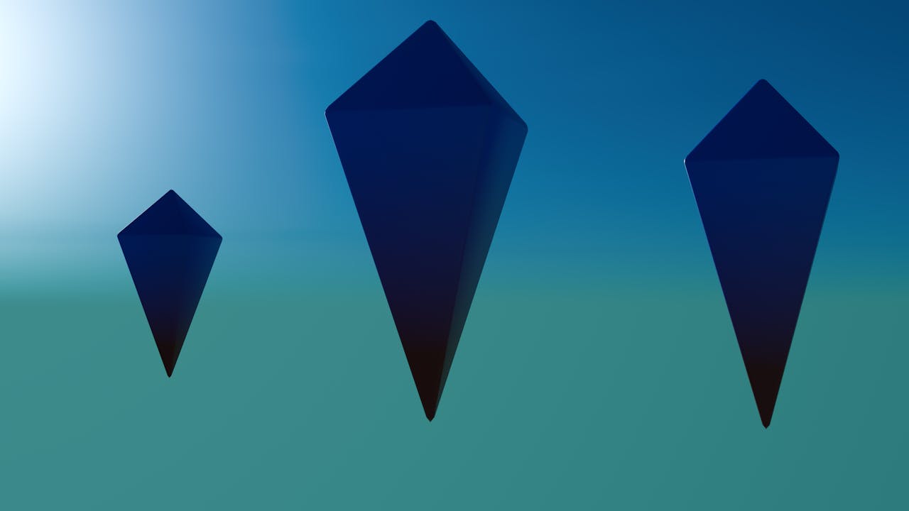 3D geometric shapes floating in a blue gradient background, rendered digitally.