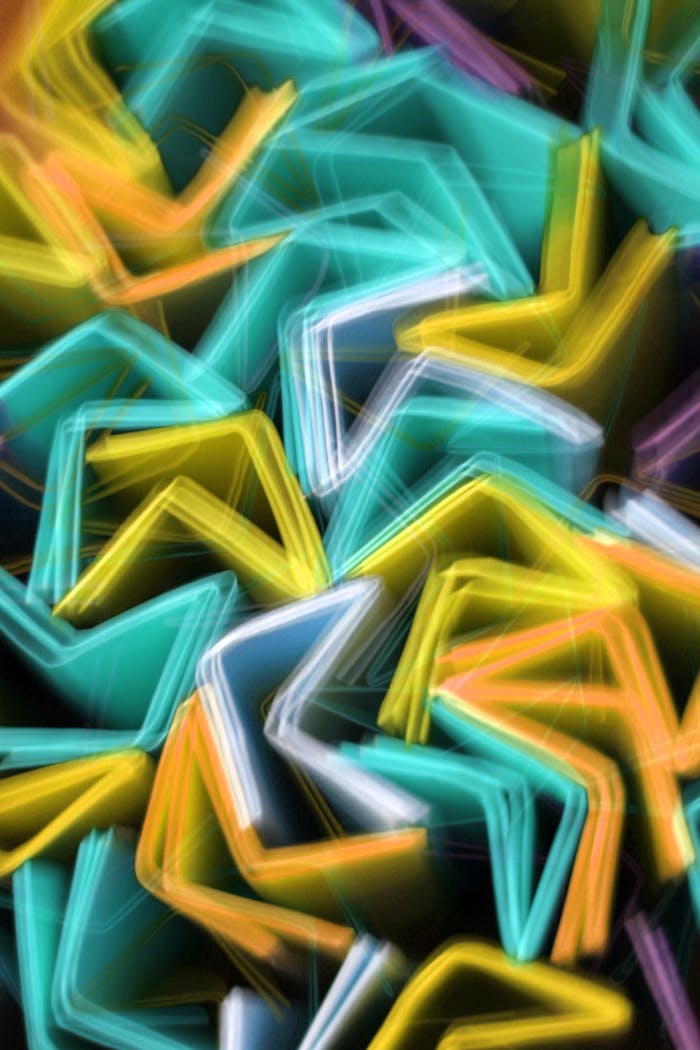 Abstract photo of colorful light trails creating dynamic shapes.